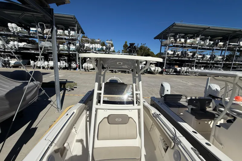 Slide: The Image of 2021 Key West 239 FS boat in storage facility with multiple boats stacked. - 23