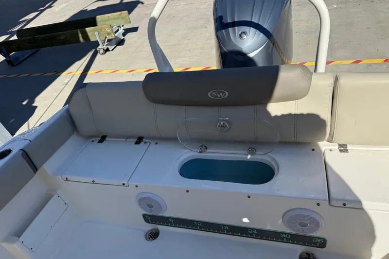 Slide: The Image of 2021 Key West 239 FS boat interior with seating and storage compartments. - 26