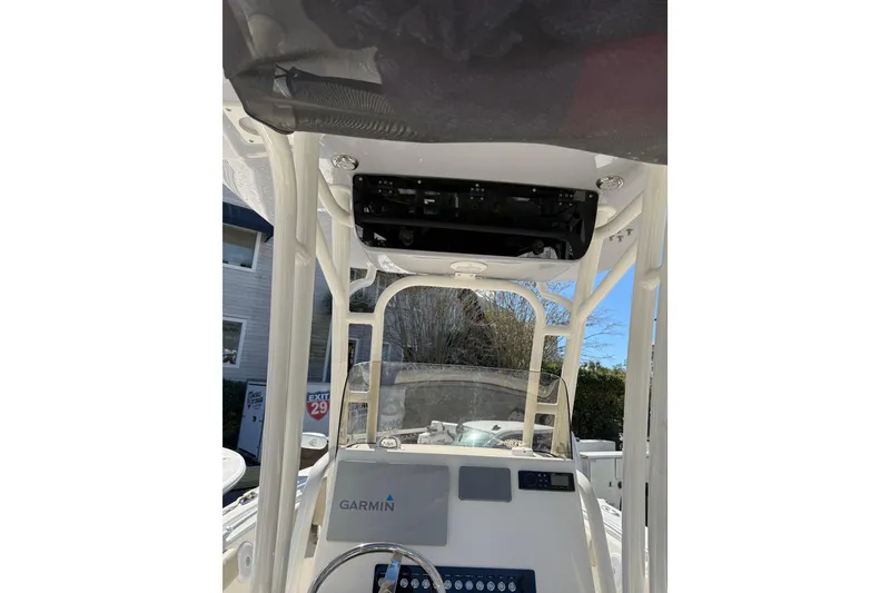 Slide: The Image of 2021 Key West 239 FS boat interior with Garmin navigation system and control panel. - 29
