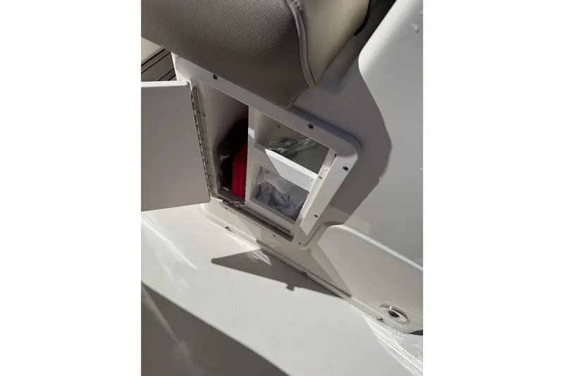 Slide: The Image of Open storage compartment on 2021 Key West 239 FS boat interior. - 30