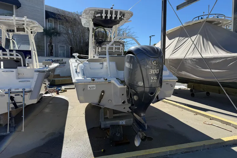 Slide: The Image of 2021 Key West 239 FS boat with Yamaha 300 V6 engine, docked outdoors. - 4