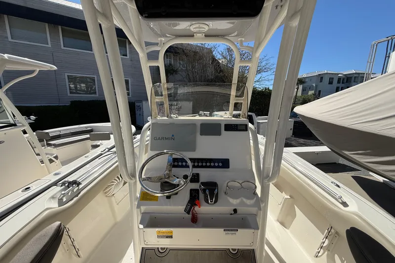 Slide: The Image of 2021 Key West 239 FS boat console with Garmin navigation system, steering wheel, and controls. - 5
