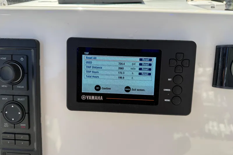 Slide: The Image of Yamaha display on 2021 Key West 239 FS boat showing trip data and settings. - 9