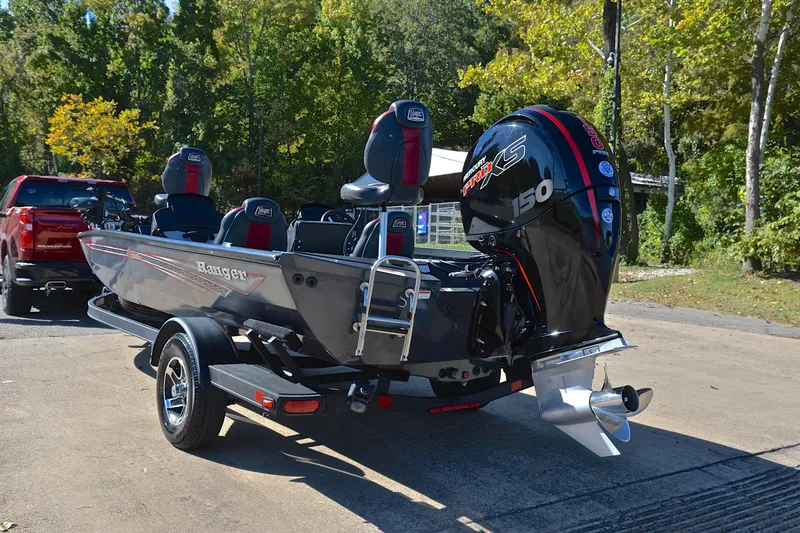 Slide: The Image of 2022 Ranger RT198P boat with Mercury 150 engine, parked outdoors. - 12