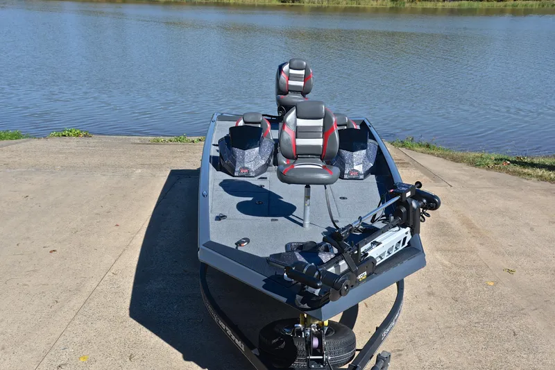 Slide: The Image of 2022 Ranger RT198P boat on a concrete ramp by a lake. - 17