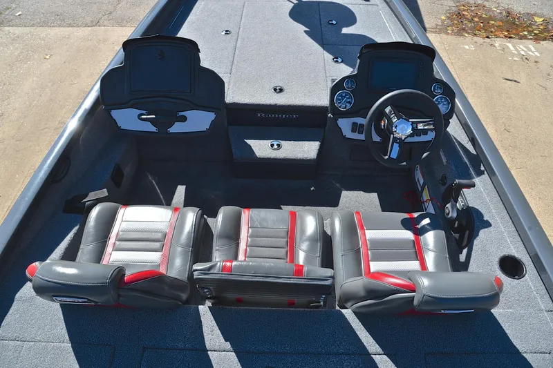 Slide: The Image of 2022 Ranger RT198P boat interior with dual seats, steering console, and storage compartments. - 20