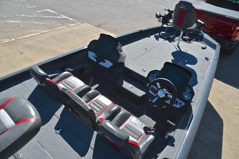 Slide: The Image of 2022 Ranger RT198P boat interior with steering wheel, seats, and control panel. - 21