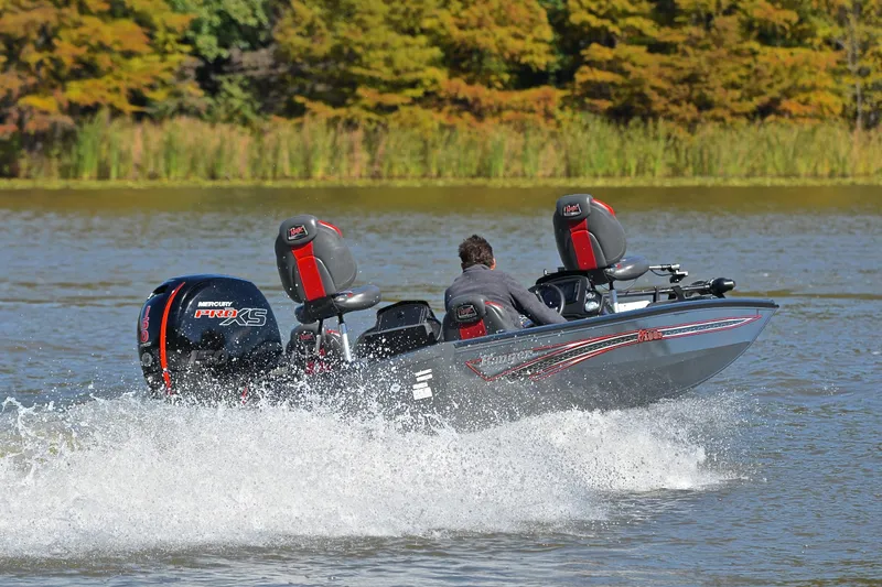 Slide: The Image of 2022 Ranger RT198P boat speeding on a lake with Mercury Pro XS engine. - 5