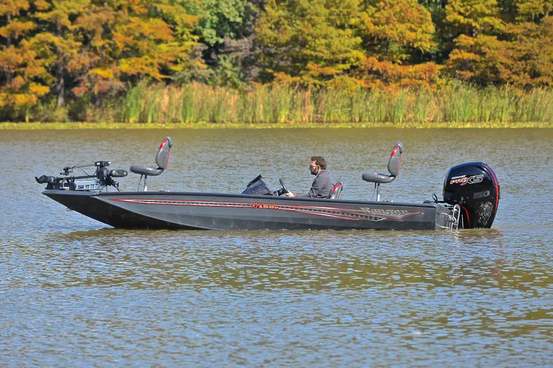 Slide: The Image of 2022 Ranger RT198P boat on a lake with autumn foliage in the background. - 9