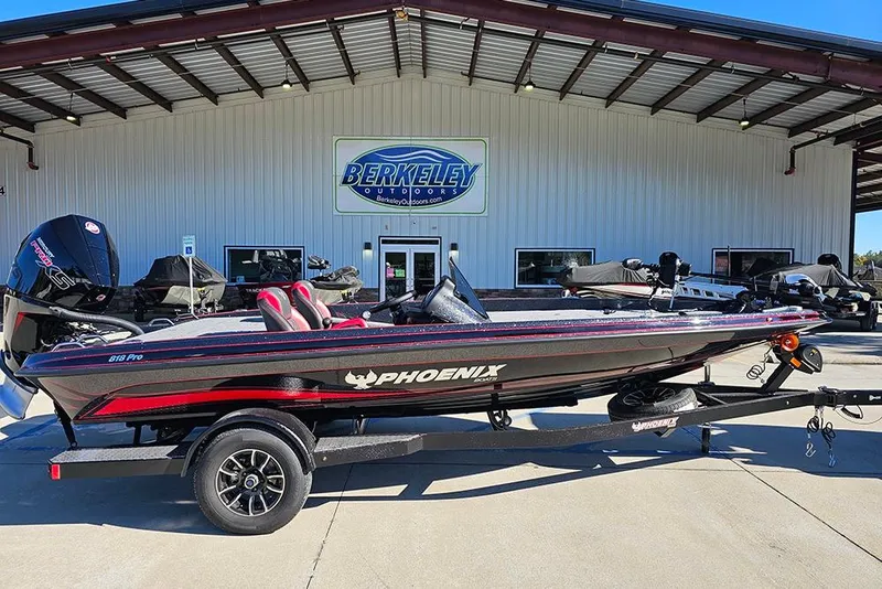 The Image of 2026 Phoenix 818 Pro boat on trailer at Berkeley Outdoors dealership. - 1