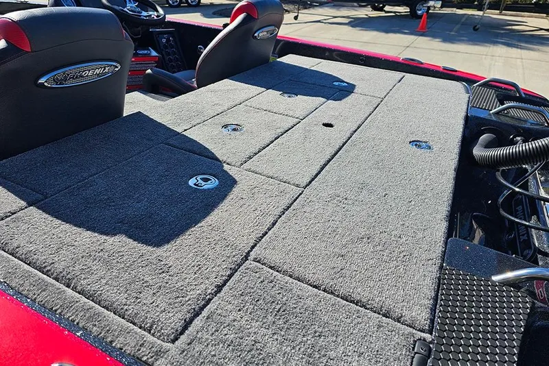 Slide: The Image of 2026 Phoenix 818 Pro boat interior with gray carpeted deck and seating. - 10
