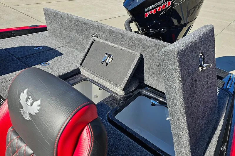 Slide: The Image of 2026 Phoenix 818 Pro boat interior with storage compartments and Mercury Pro engine. - 11