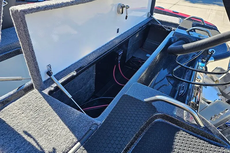Slide: The Image of Open storage compartment in a 2026 Phoenix 818 Pro boat, showing interior details and wiring. - 13