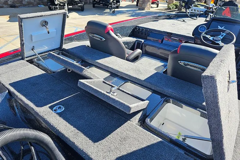 Slide: The Image of 2026 Phoenix 818 Pro boat interior with open storage compartments and seating. - 14