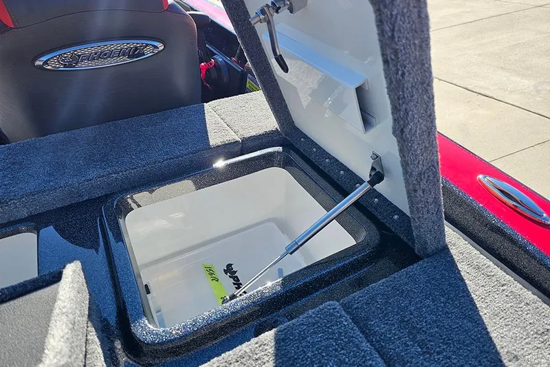 Slide: The Image of Open storage compartment in 2026 Phoenix 818 Pro boat, showcasing interior details. - 15
