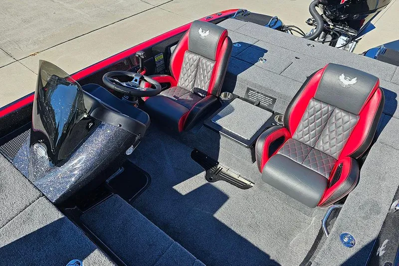 Slide: The Image of 2026 Phoenix 818 Pro boat interior with red and black seats, steering wheel, and dashboard. - 16