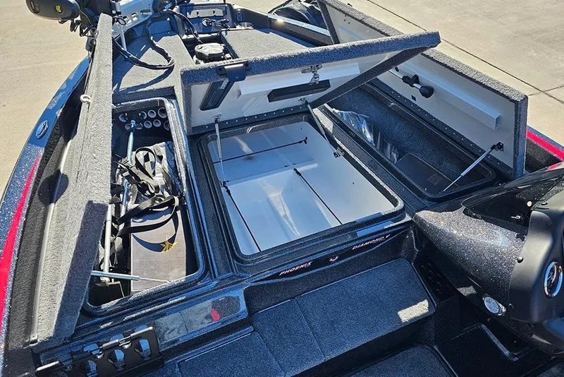 Slide: The Image of 2026 Phoenix 818 Pro boat interior with open storage compartments and equipment. - 26