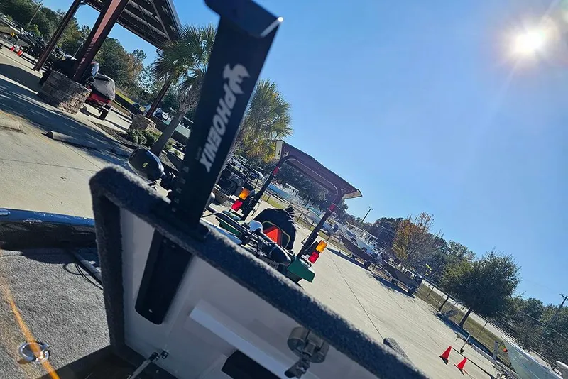 Slide: The Image of 2026 Phoenix 818 Pro boat at sunny outdoor marina with palm trees. - 27