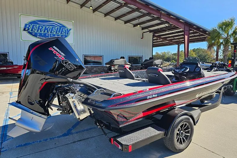 Slide: The Image of 2026 Phoenix 818 Pro boat at Berkeley Outdoors dealership, featuring sleek design and powerful engine. - 3