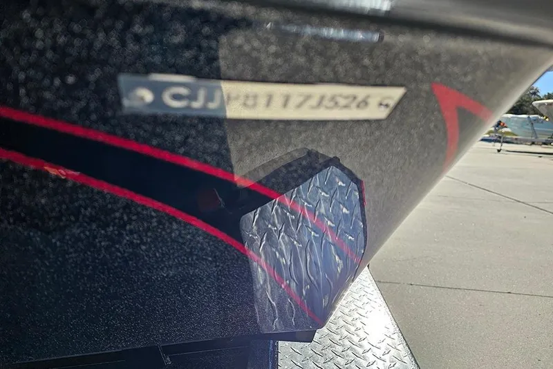 Slide: The Image of 2026 Phoenix 818 Pro boat hull with registration number, featuring sleek design and red accents. - 33
