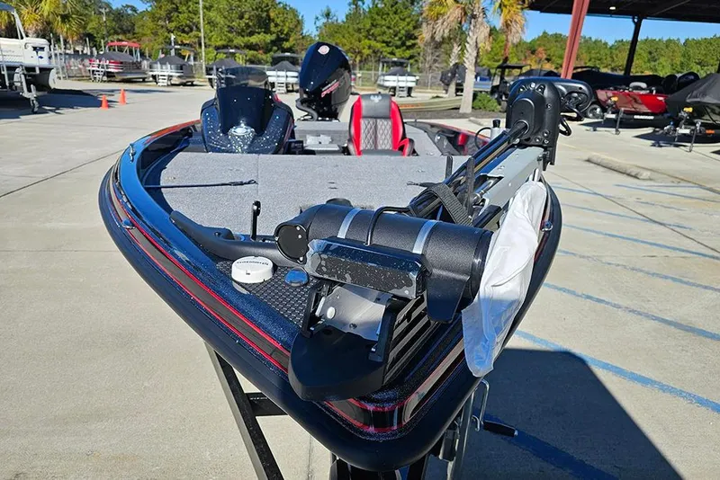 Slide: The Image of 2026 Phoenix 818 Pro boat with advanced features, parked outdoors on a sunny day. - 4