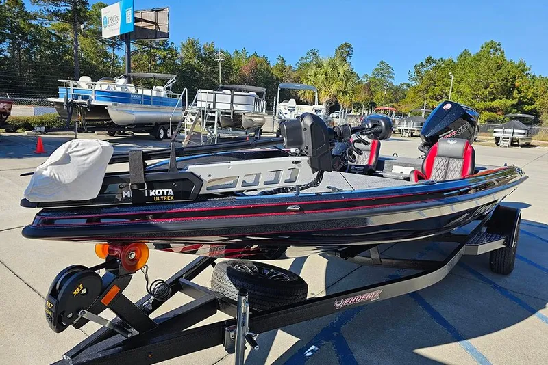 Slide: The Image of 2026 Phoenix 818 Pro fishing boat on trailer, featuring Minn Kota Ultrex motor. - 5