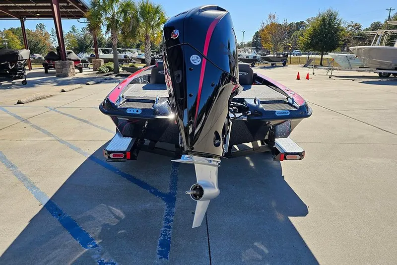 Slide: The Image of 2026 Phoenix 818 Pro boat with powerful outboard motor, parked outdoors. - 8