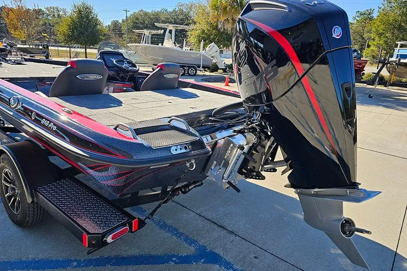 Slide: The Image of 2026 Phoenix 818 Pro boat with sleek design and powerful outboard motor. - 9