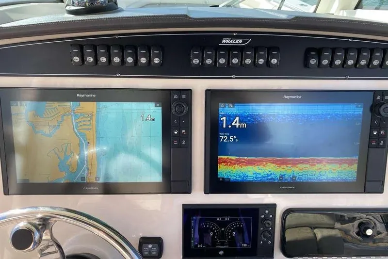 Slide: The Image of Dashboard of 2019 Boston Whaler 330 Outrage with Raymarine navigation displays. - 7