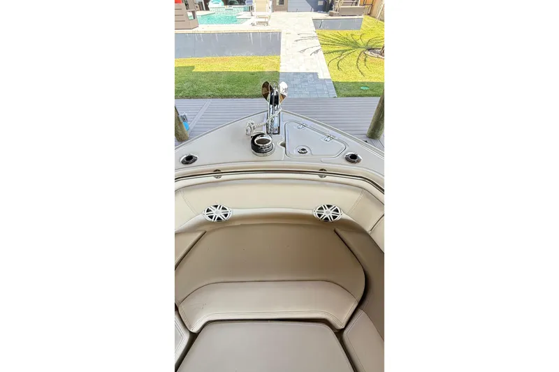Slide: The Image of 2023 Boston Whaler 230 Outrage boat interior with seating and speakers. - 12
