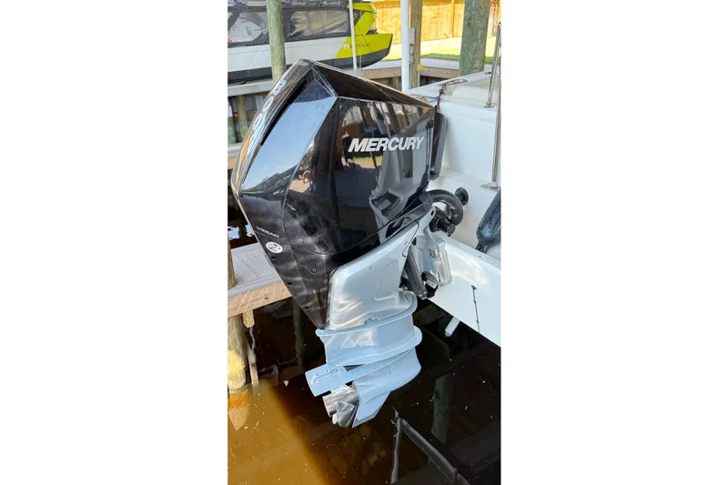 Slide: The Image of 2023 Boston Whaler 230 Outrage with Mercury outboard engine docked. - 15