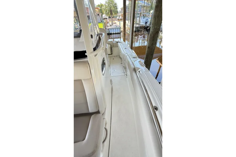 Slide: The Image of 2023 Boston Whaler 230 Outrage interior view, showcasing seating and deck details. - 9