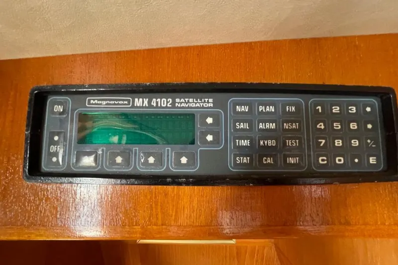 Slide: The Image of Magnavox MX 4102 satellite navigator on 1990 Offshore Yachts 55 Pilothouse. - 13