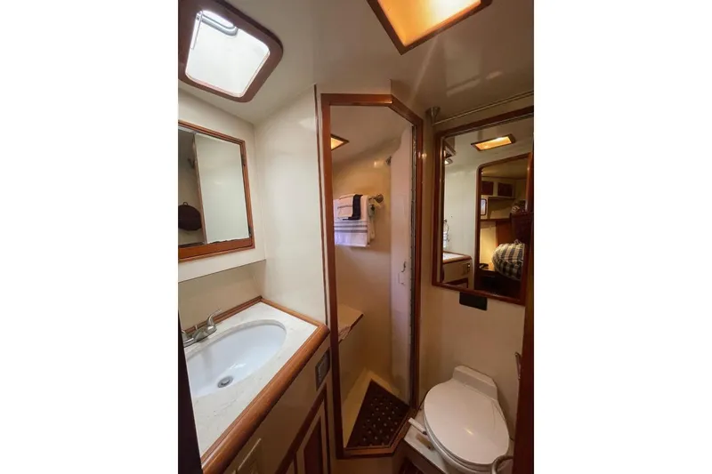 Slide: The Image of Bathroom interior of 1990 Offshore Yachts 55 Pilothouse with sink and toilet. - 22