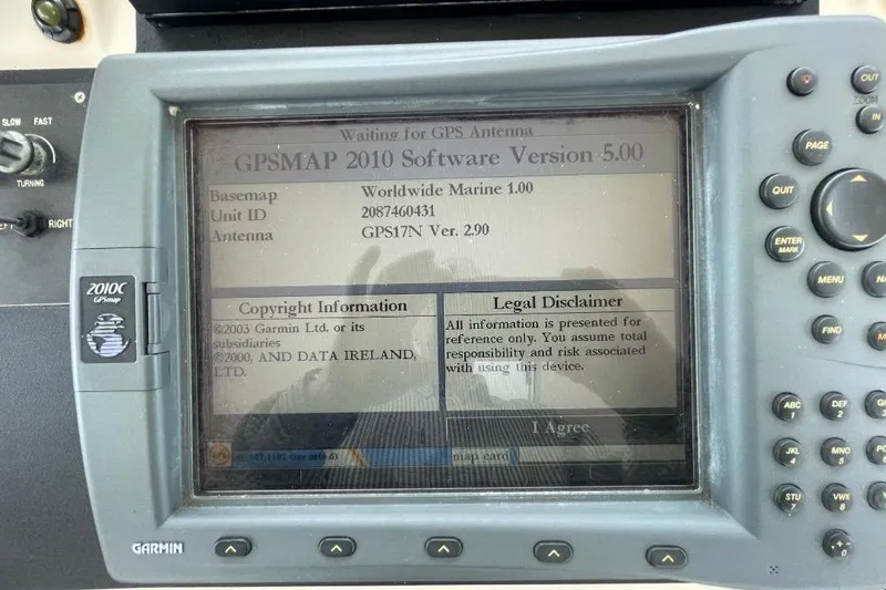 Slide: The Image of Garmin GPSMAP 2010C display on 1990 Offshore Yachts 55 Pilothouse, showing software version and legal disclaimer. - 37