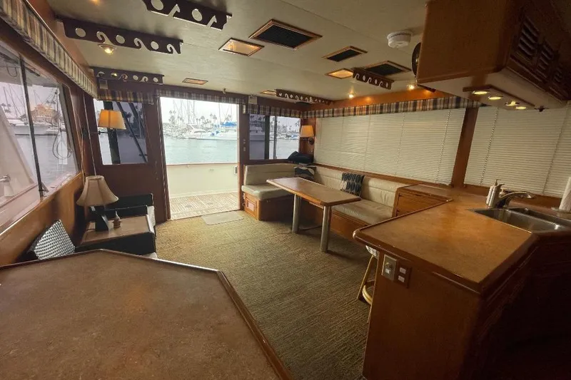 Slide: The Image of Luxurious interior of 1990 Offshore Yachts 55 Pilothouse with spacious seating and elegant decor. - 4