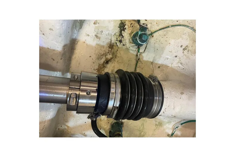 Slide: The Image of Close-up of a 1990 Offshore Yachts 55 Pilothouse shaft seal in the engine room. - 52