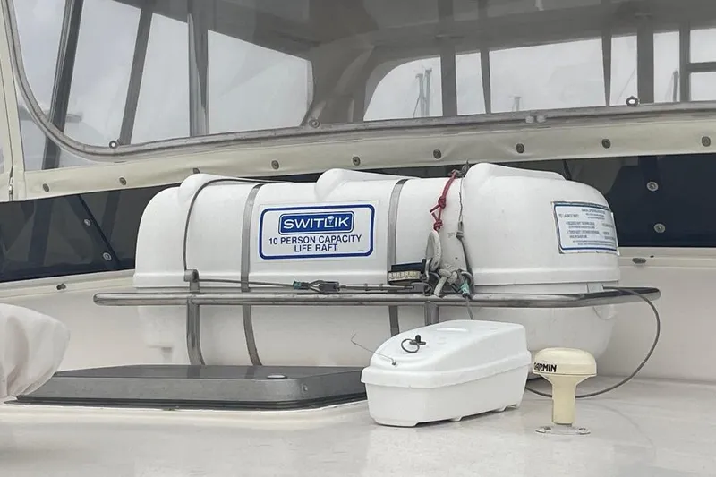 Slide: The Image of Life raft on 1990 Offshore Yachts 55 Pilothouse, 10-person capacity, Switlik brand. - 53