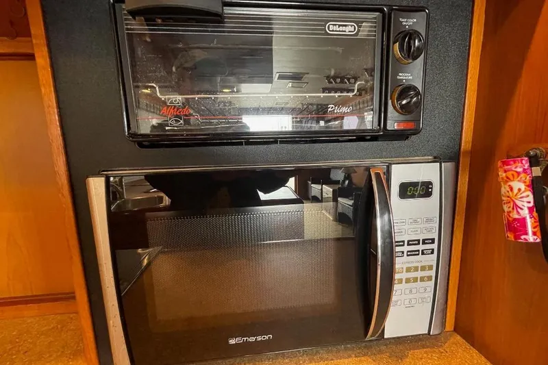 Slide: The Image of Toaster oven and microwave in 1990 Offshore Yachts 55 Pilothouse kitchen. - 8