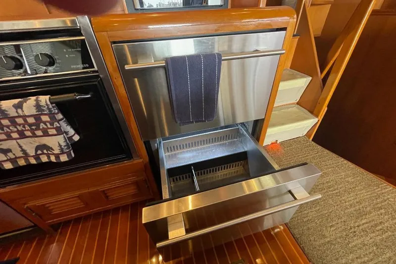 Slide: The Image of Stainless steel drawer in 1990 Offshore Yachts 55 Pilothouse kitchen interior. - 9