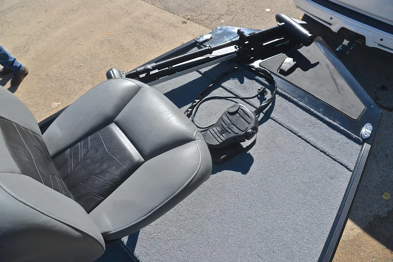 Slide: The Image of 2024 Bass Tracker Classic boat seat and trolling motor on deck. - 25