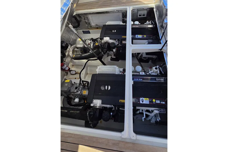 Slide: The Image of Engine compartment of 2011 MJM 40z Downeast boat, showcasing dual Volvo Penta engines. - 41