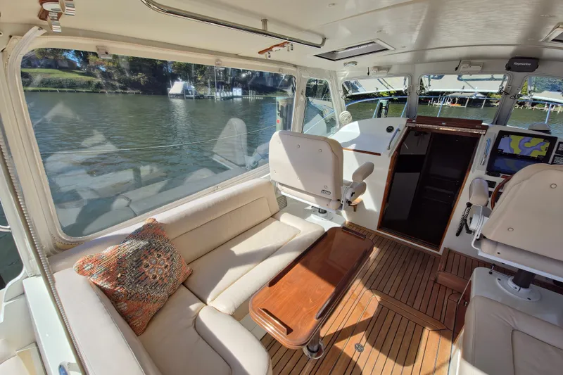 Slide: The Image of Luxurious interior of 2011 MJM 40z Downeast yacht with plush seating and wooden accents. - 17
