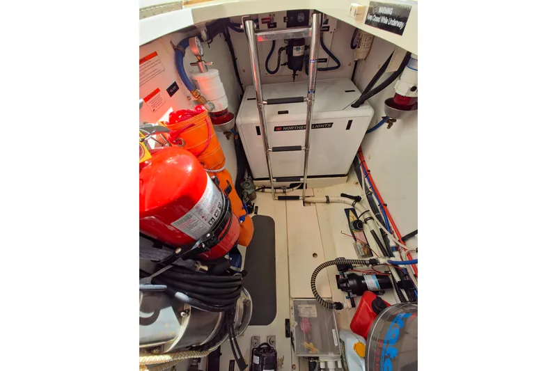 Slide: The Image of Engine room of 2011 MJM 40z Downeast boat with equipment and fire extinguisher. - 40