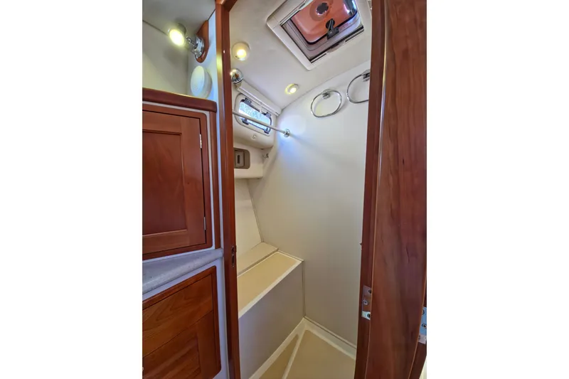 Slide: The Image of Interior of 2011 MJM 40z Downeast yacht bathroom with wooden cabinetry and lighting. - 37