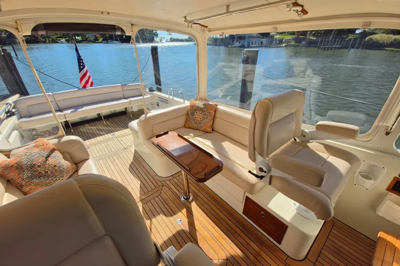 Slide: The Image of Luxurious 2011 MJM 40z Downeast yacht interior with elegant seating and scenic water view. - 18