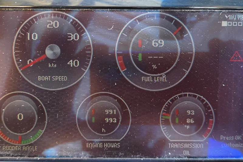 Slide: The Image of Dashboard of a 2011 MJM 40z Downeast showing boat speed, fuel level, and engine metrics. - 44