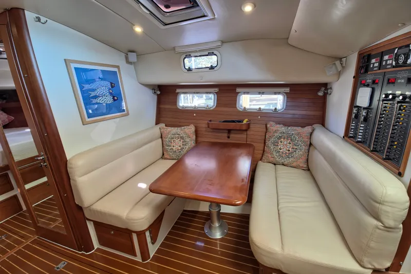 Slide: The Image of Interior of 2011 MJM 40z Downeast yacht with cozy seating and wooden table. - 24