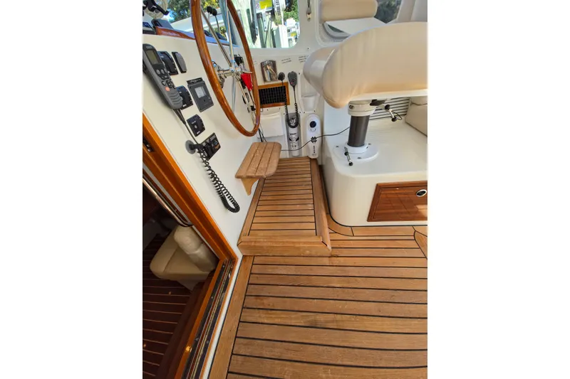 Slide: The Image of Helm station of 2011 MJM 40z Downeast boat with wooden flooring and navigation equipment. - 21