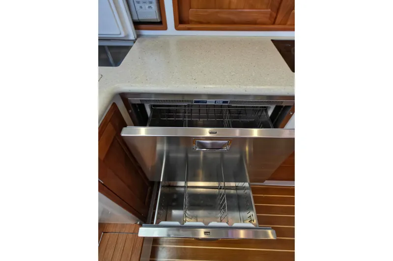 Slide: The Image of Open dishwasher drawer in 2011 MJM 40z Downeast yacht kitchen. - 28